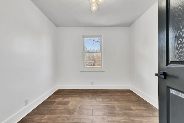 unfurnished room featuring wood-type flooring