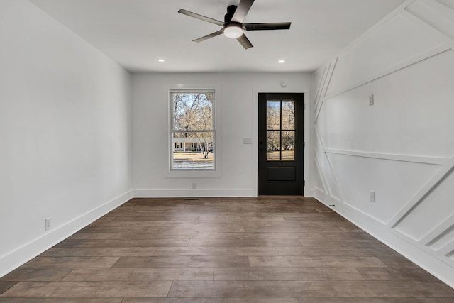 foyer entrance with hardwood / wood-style flooring and ceiling fan