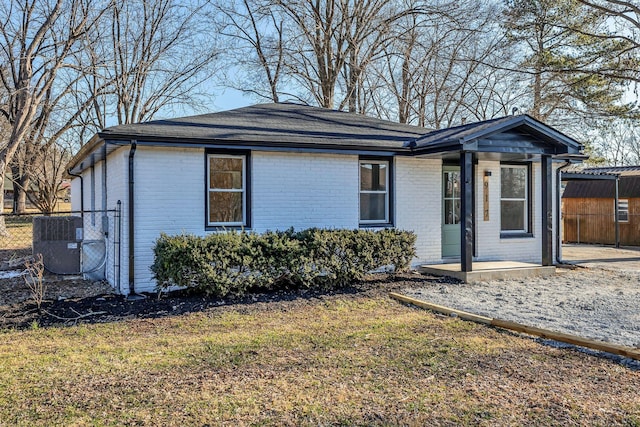 ranch-style house featuring central AC unit