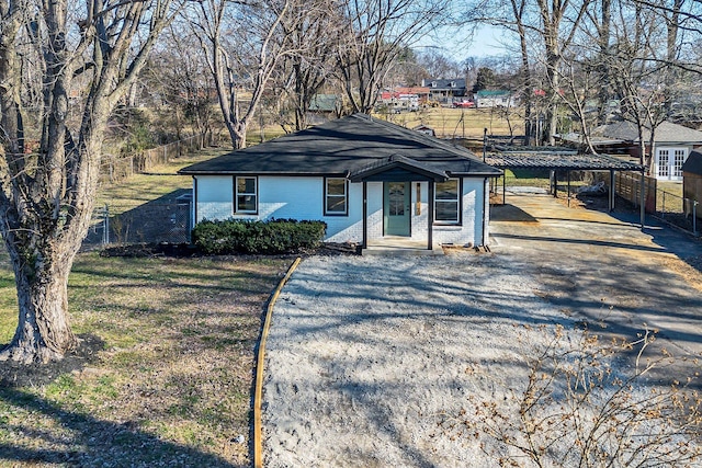 view of front of home with a carport