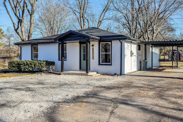 view of front of home featuring a carport