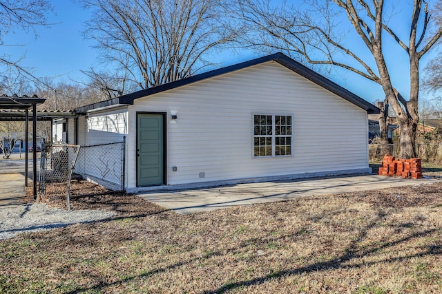 rear view of property featuring a patio