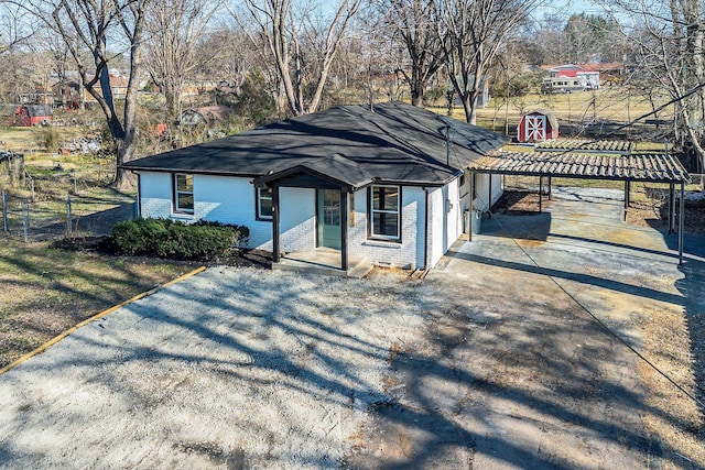 view of front of property with a carport