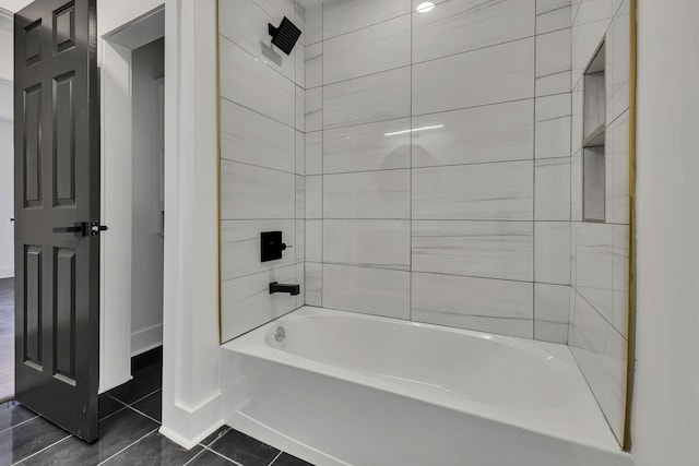 bathroom featuring washtub / shower combination and tile patterned floors