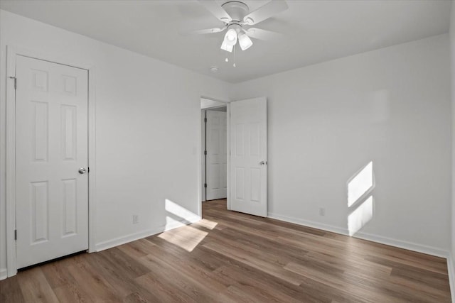 unfurnished bedroom featuring ceiling fan and hardwood / wood-style floors