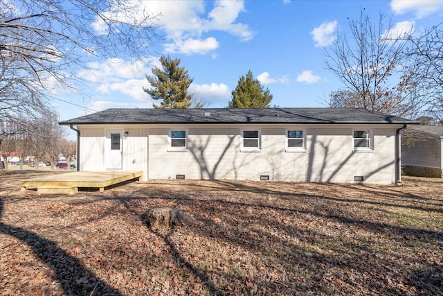 back of property featuring a deck