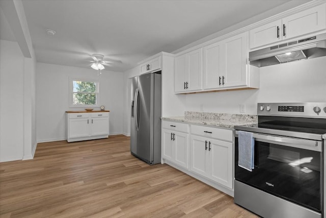 kitchen featuring white cabinets, light stone countertops, and appliances with stainless steel finishes