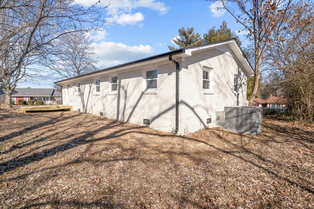 view of side of property with cooling unit