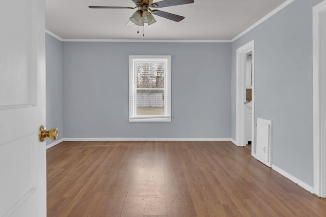 spare room featuring ceiling fan, hardwood / wood-style floors, and ornamental molding