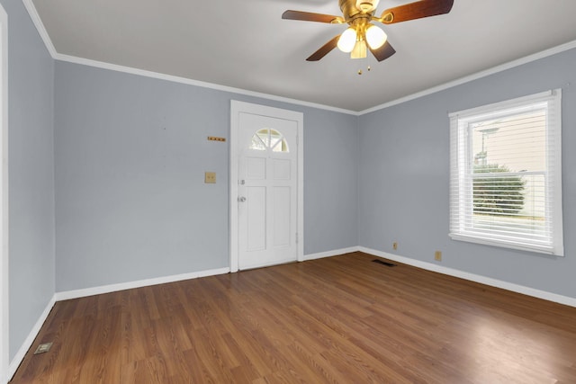 entryway featuring ceiling fan, wood-type flooring, and crown molding