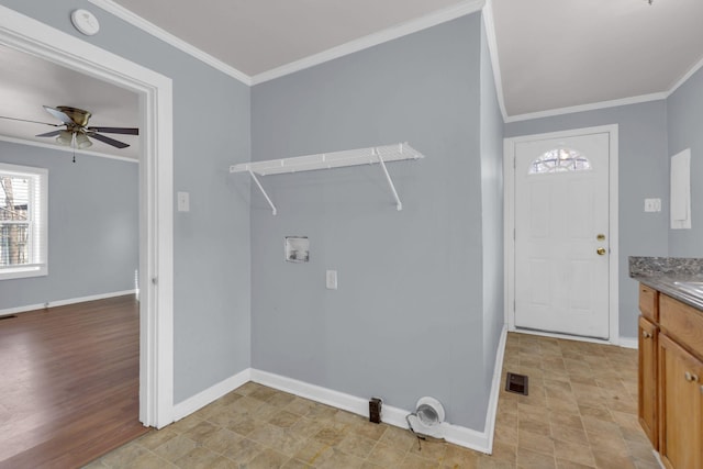 laundry area featuring ceiling fan, crown molding, and hookup for a washing machine