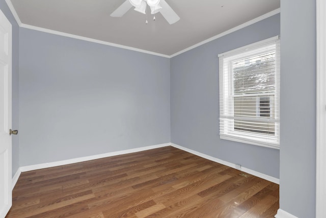 unfurnished room featuring ceiling fan, dark hardwood / wood-style floors, and crown molding