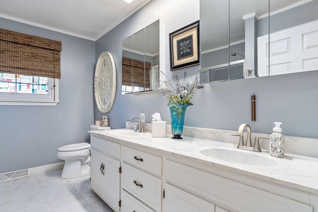 bathroom featuring ornamental molding, toilet, and vanity