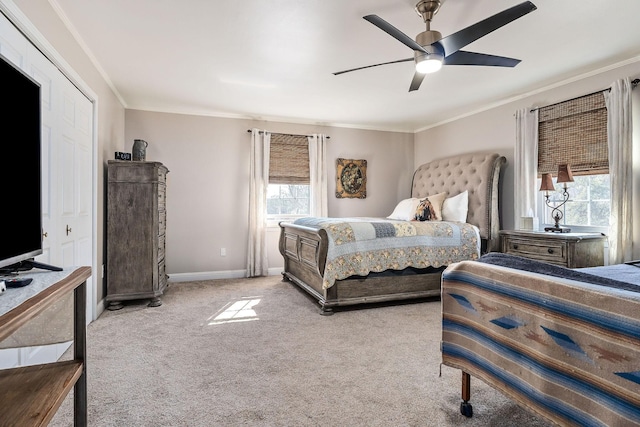 carpeted bedroom featuring ceiling fan and ornamental molding