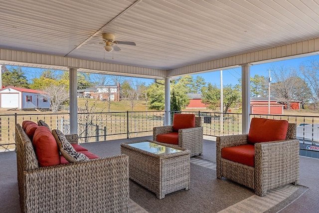 sunroom featuring ceiling fan