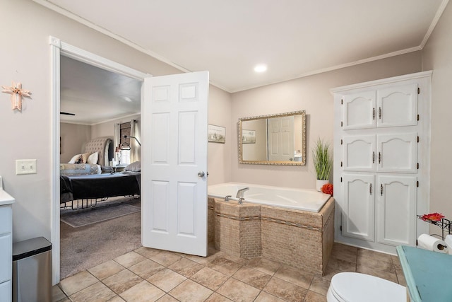 bathroom with tiled tub, toilet, crown molding, and tile patterned flooring