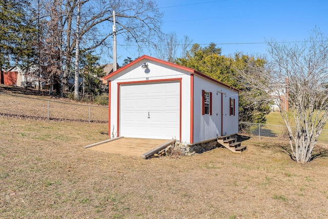 garage featuring a lawn