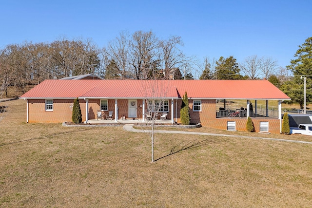 single story home with covered porch and a front yard