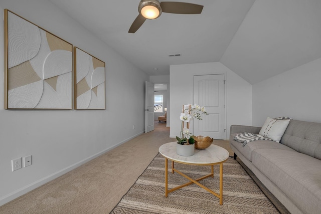 living room with ceiling fan, carpet, and lofted ceiling