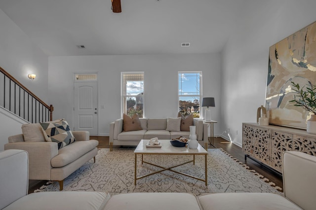 living room featuring hardwood / wood-style flooring and ceiling fan