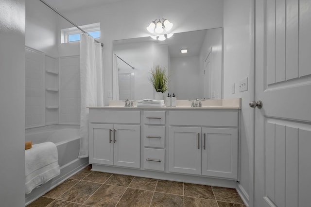 bathroom featuring vanity and shower / bath combo