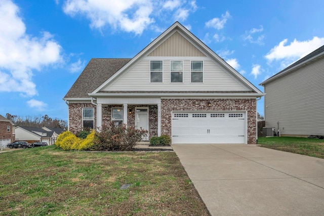 view of front of property with a garage, a front yard, and cooling unit