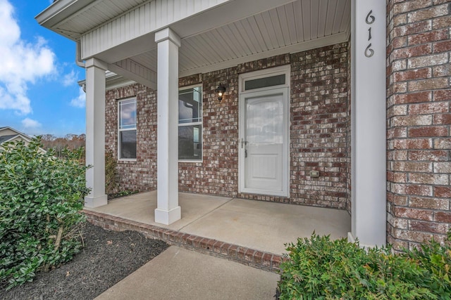 doorway to property featuring a porch