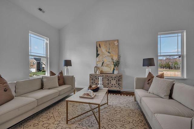 living room featuring vaulted ceiling