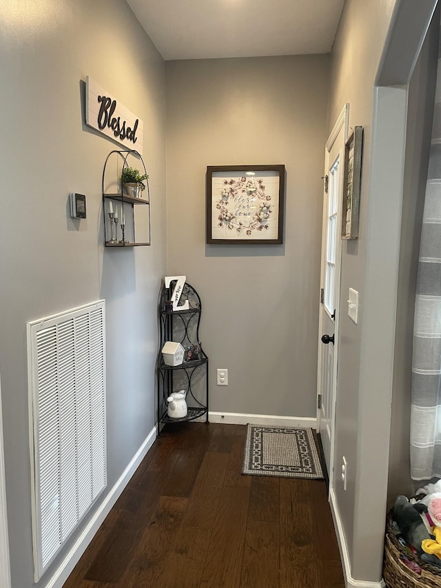 doorway to outside featuring dark hardwood / wood-style floors