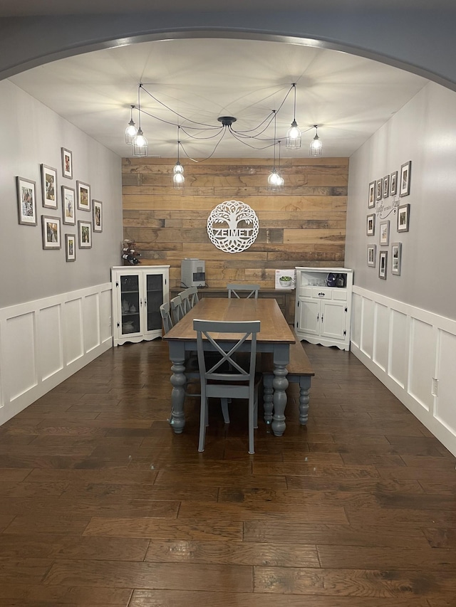 dining space with dark wood-type flooring