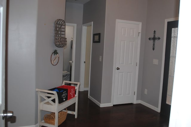 corridor featuring dark hardwood / wood-style floors