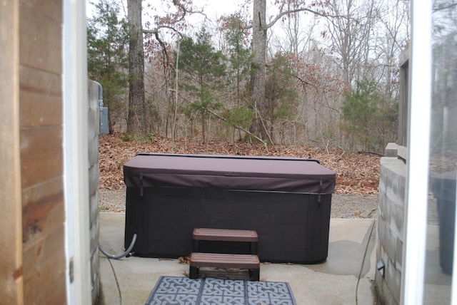 view of patio / terrace with a hot tub