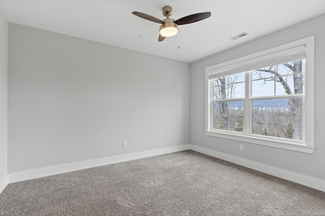 unfurnished room with carpet floors and ceiling fan