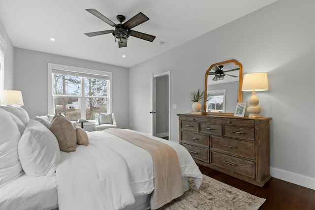 bedroom featuring ceiling fan and dark hardwood / wood-style flooring