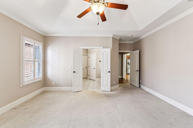 unfurnished bedroom featuring ceiling fan, a tray ceiling, stainless steel fridge with ice dispenser, and light carpet