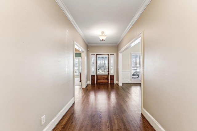 entryway featuring ornamental molding and dark hardwood / wood-style floors