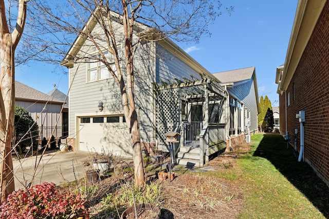 view of property exterior featuring a garage and a pergola