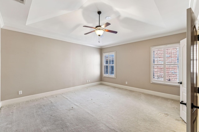 empty room featuring ceiling fan, light carpet, and ornamental molding