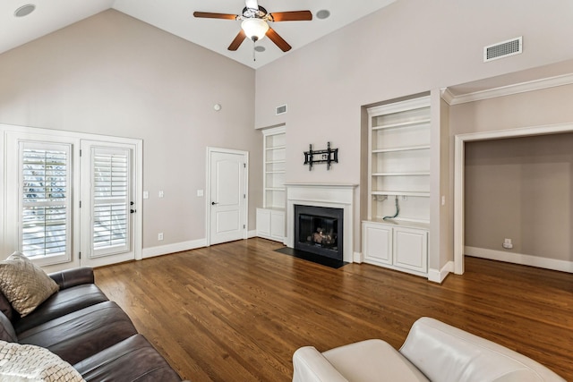 living room with built in features, ceiling fan, high vaulted ceiling, and dark hardwood / wood-style floors