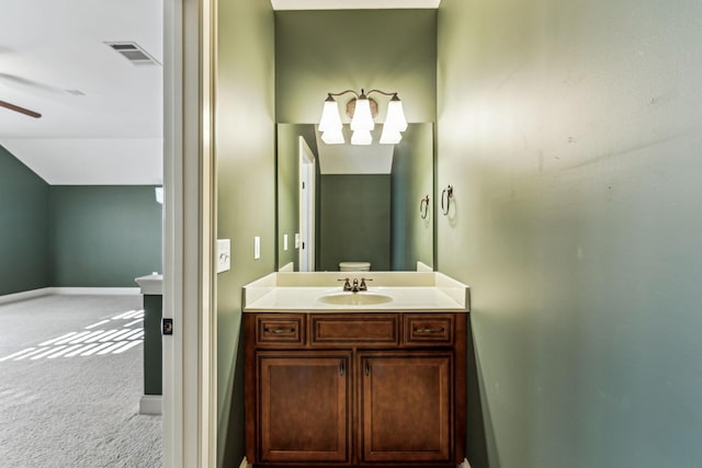 bathroom with ceiling fan and vanity