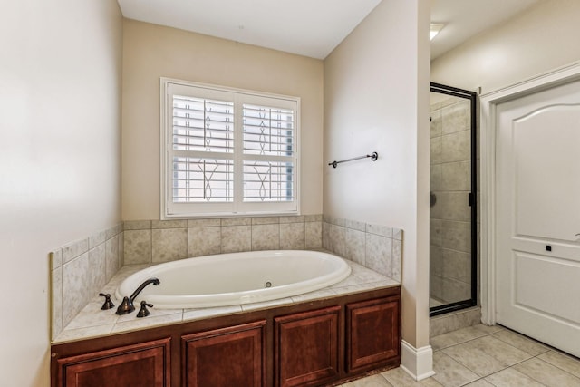 bathroom featuring shower with separate bathtub and tile patterned floors