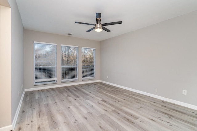 unfurnished room with ceiling fan and light hardwood / wood-style floors