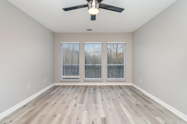 spare room with ceiling fan and light hardwood / wood-style floors