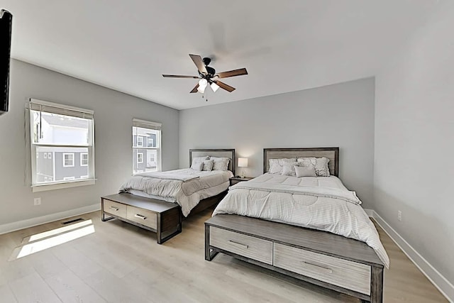 bedroom featuring light hardwood / wood-style floors and ceiling fan