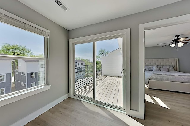 entryway with hardwood / wood-style flooring, a healthy amount of sunlight, and ceiling fan