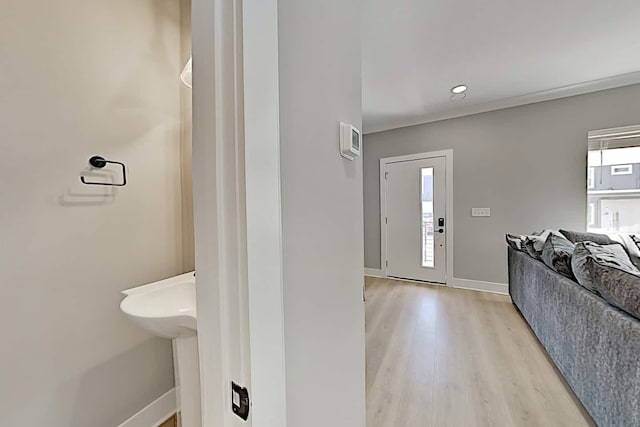 foyer entrance with light wood-type flooring