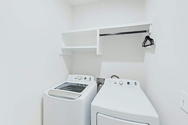 washroom featuring independent washer and dryer