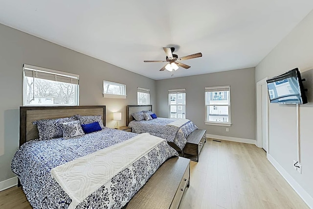 bedroom featuring ceiling fan and light hardwood / wood-style flooring