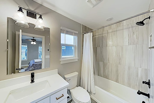 full bathroom featuring toilet, vanity, and shower / tub combo with curtain