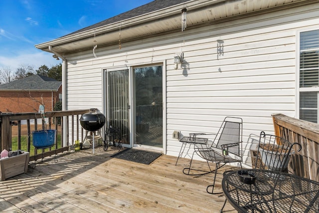 wooden deck featuring grilling area